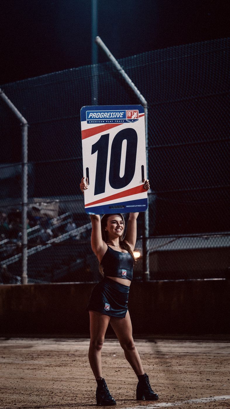 Madison holding the number board at the DuQuoin Mile