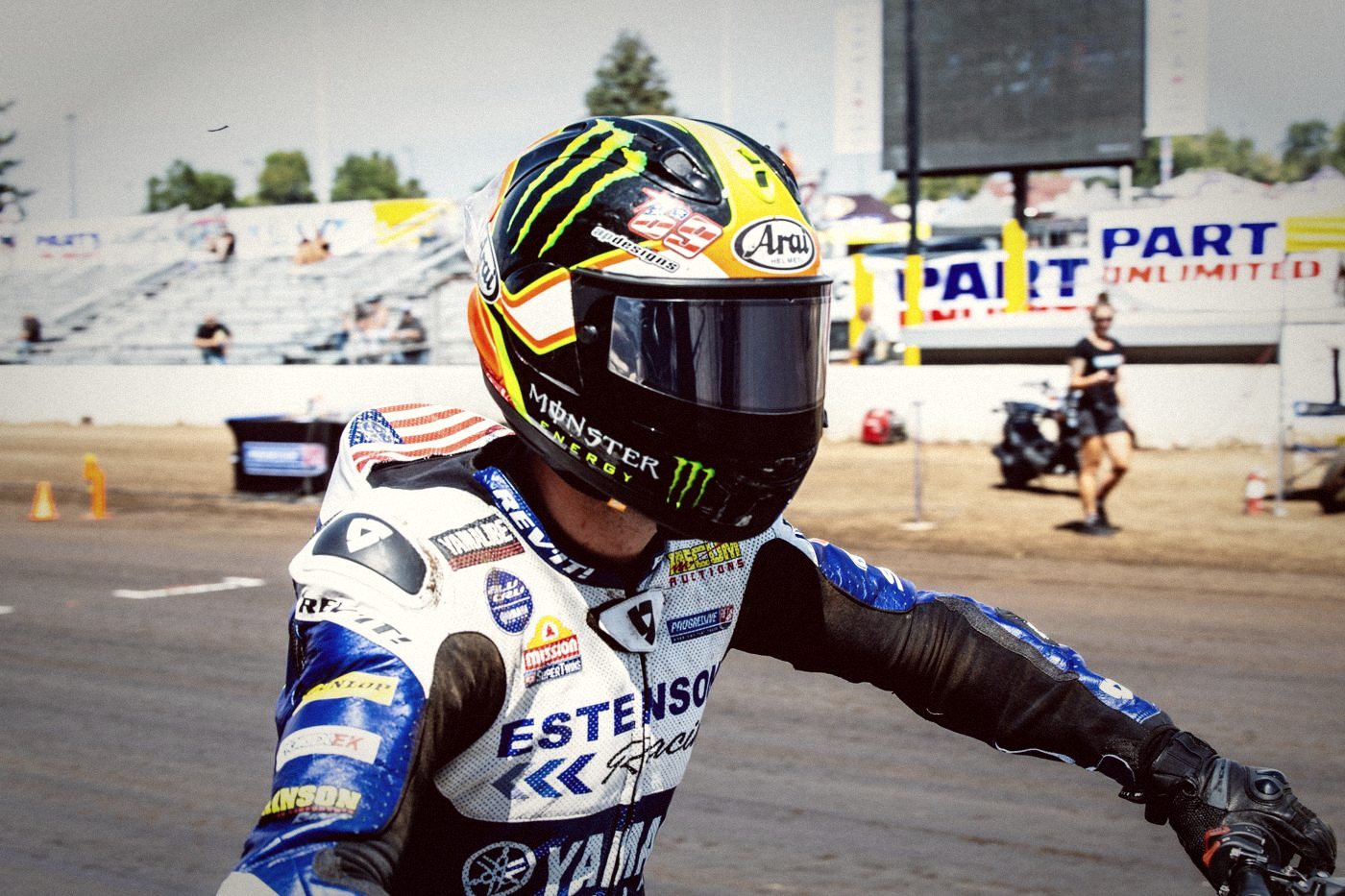 An American Flat Track rider in a Monster Energy helmet
