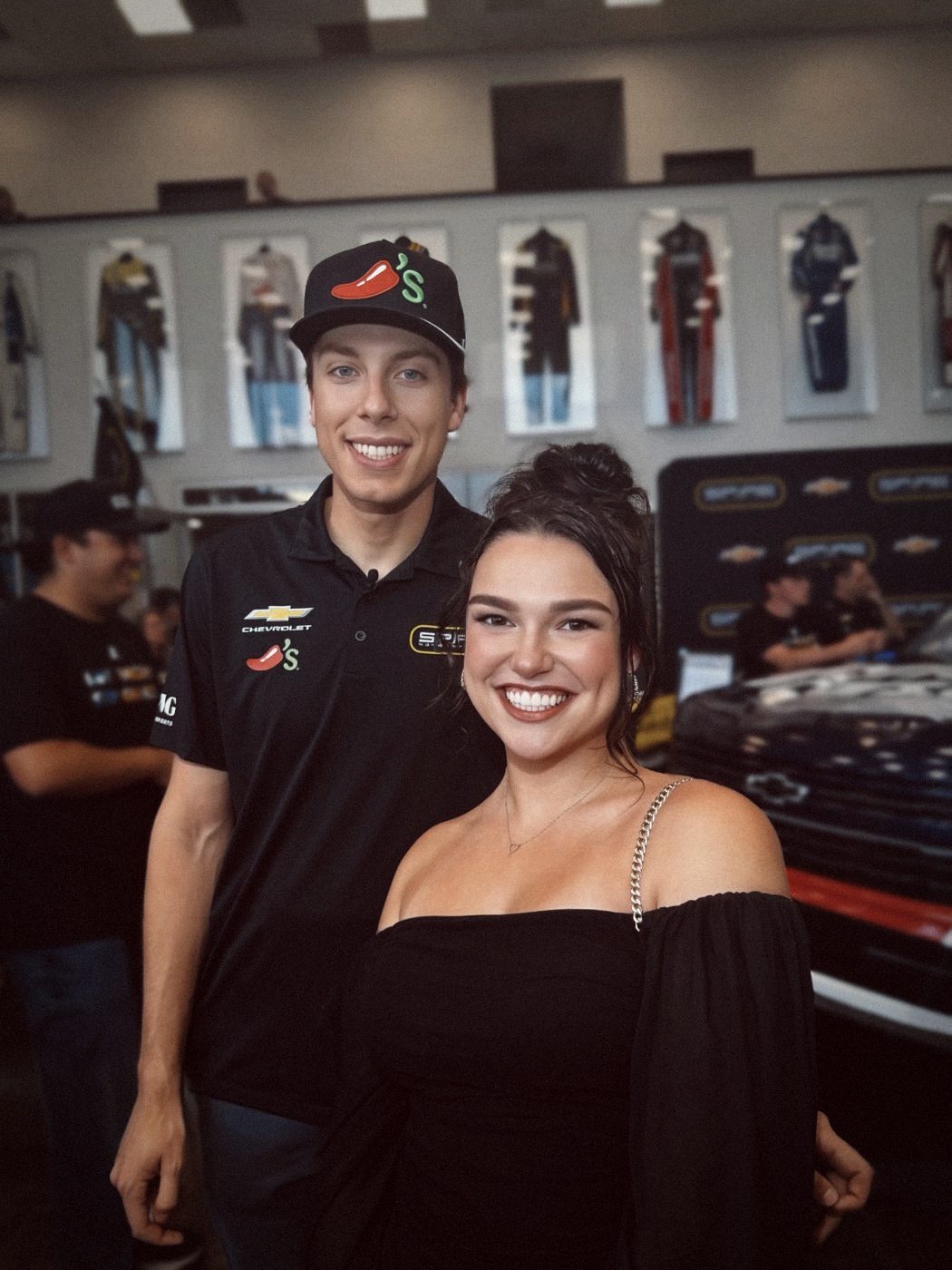 Madison with a NASCAR driver in a team garage