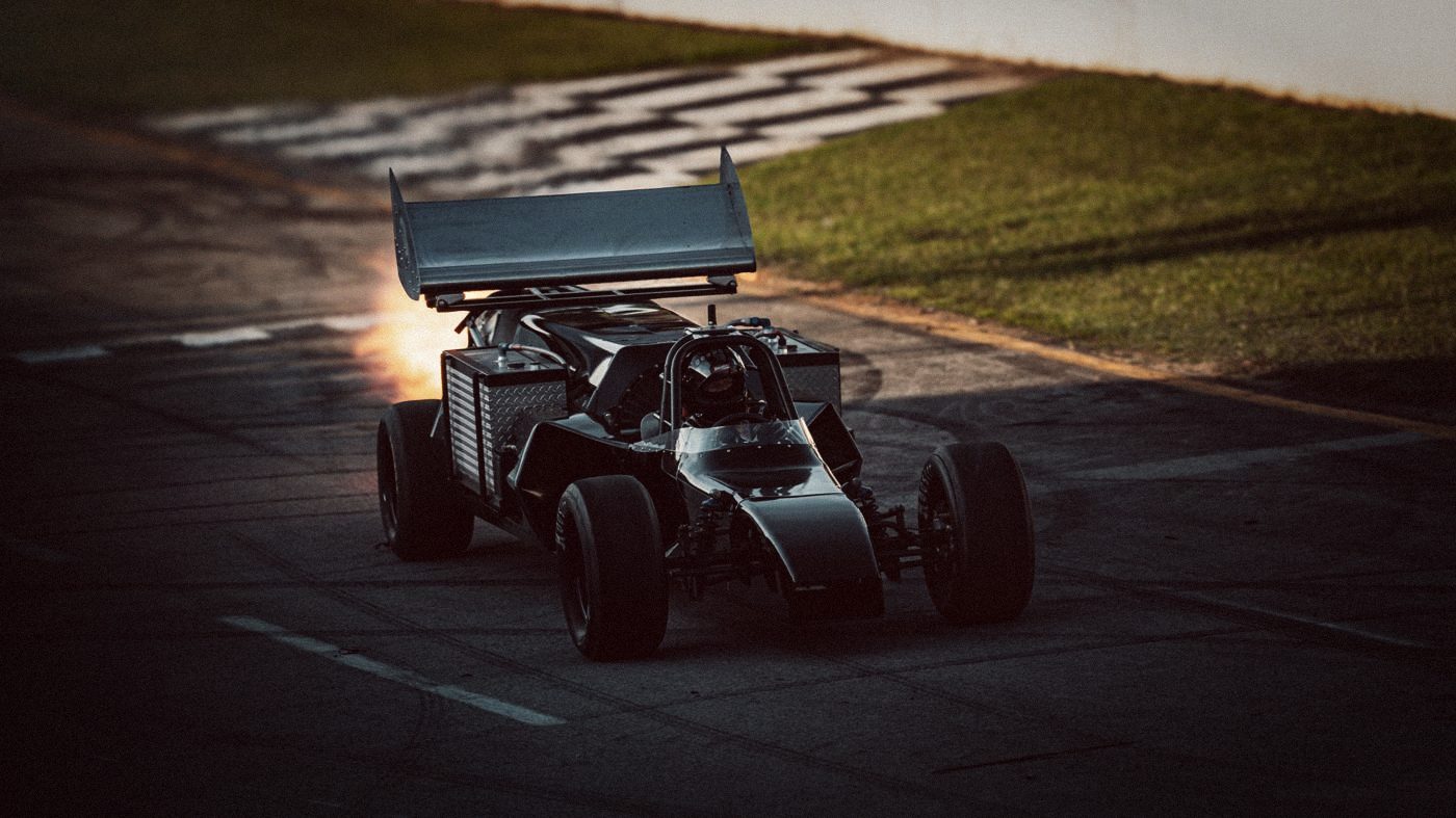 A jet car firing down the front stretch