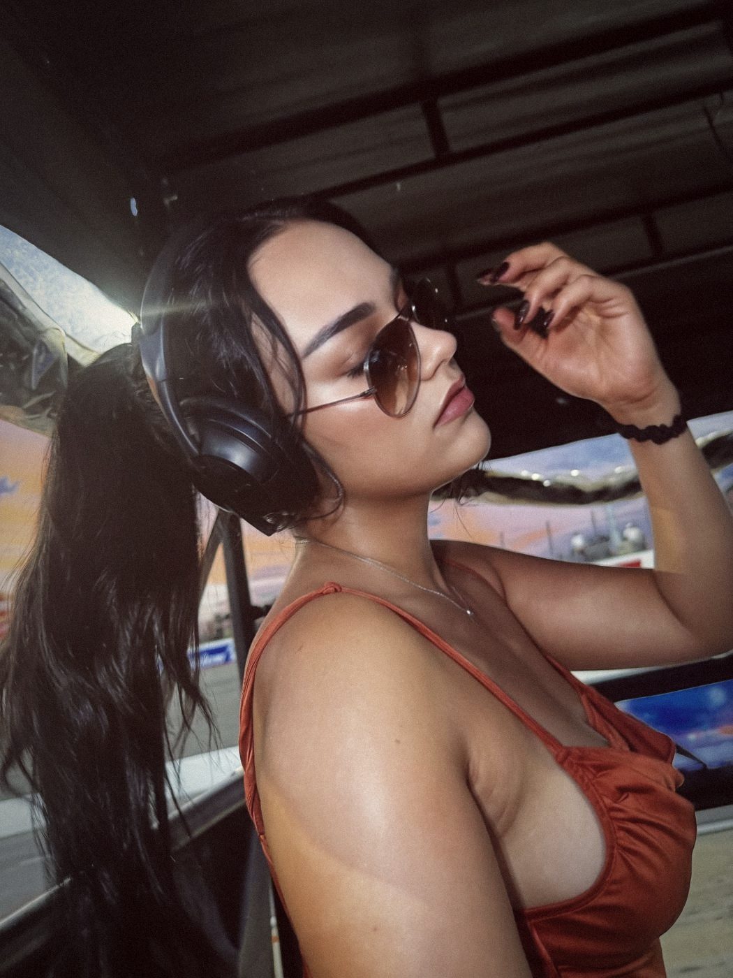 Madison wearing a team headset trackside